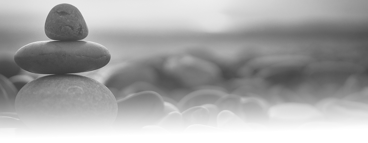 Grayscale photo of sunset with pebbles on beach in Nice, France