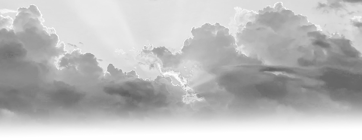 The morning sky where the sun is rising from the horizon grayscale stock photo